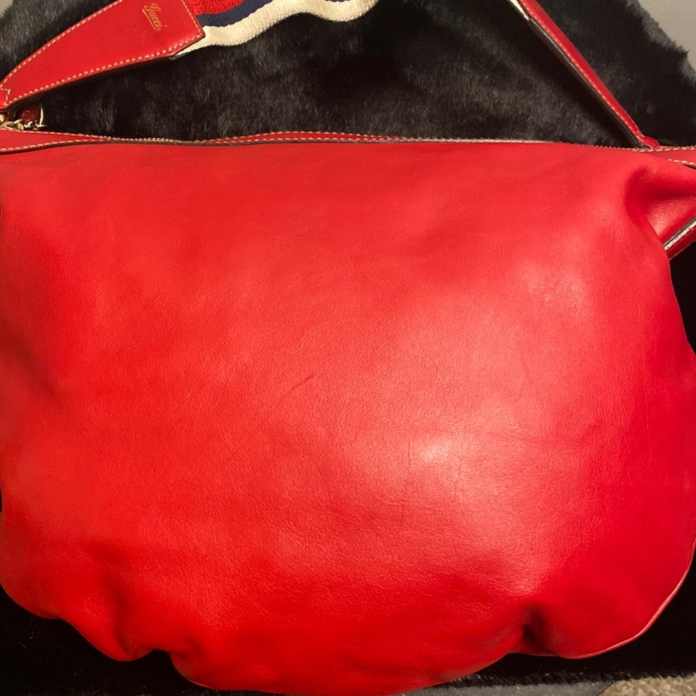 Red leather Gucci bag with matching wallet